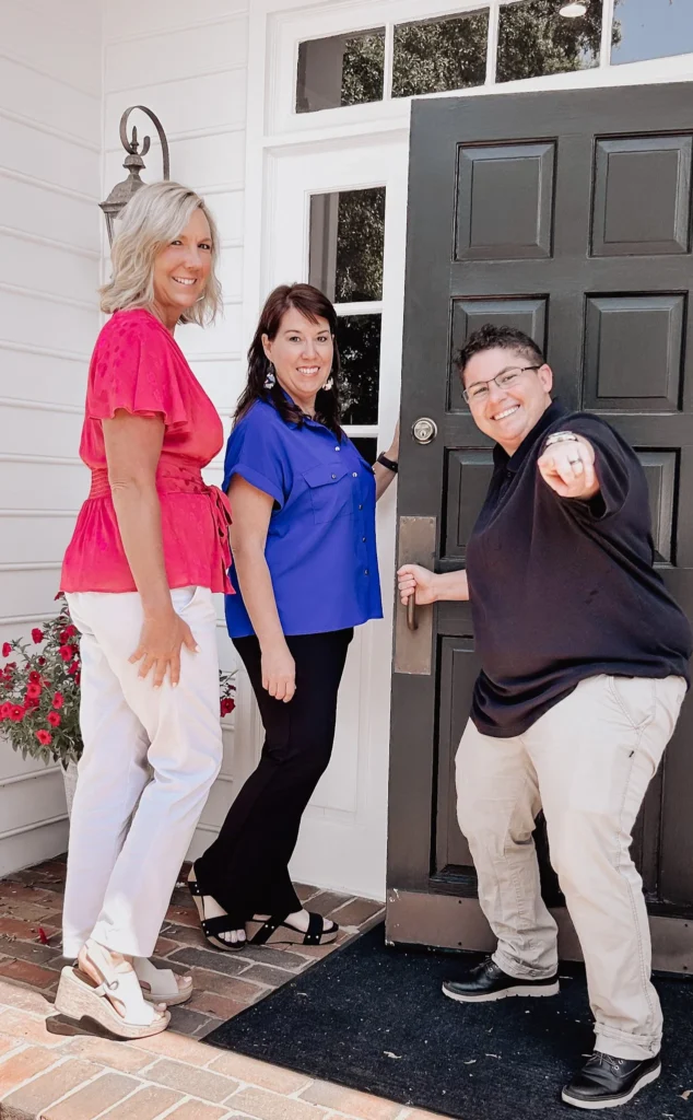 Counselors in the doorway of the office