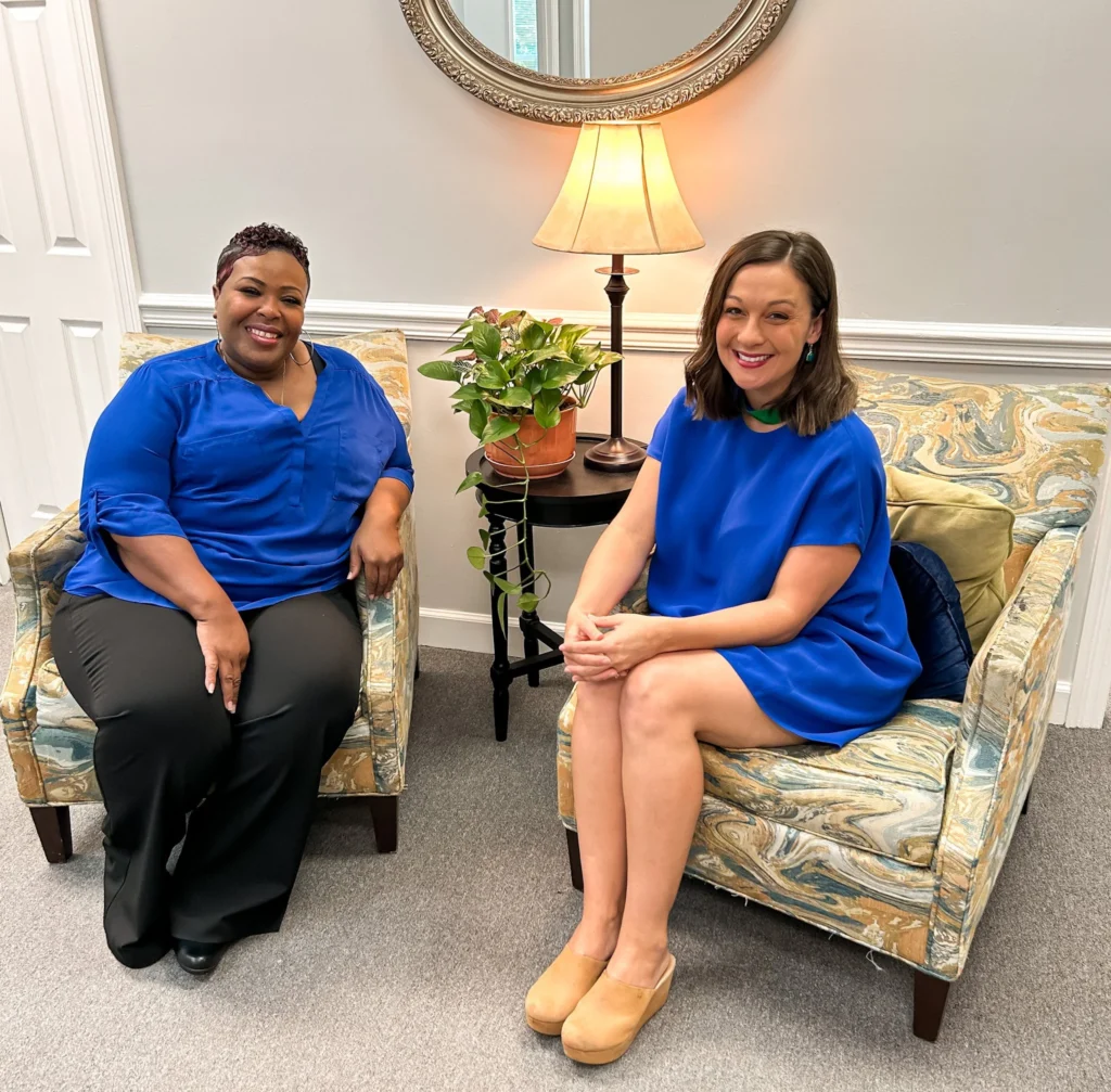 Two counselors seated in a counseling room