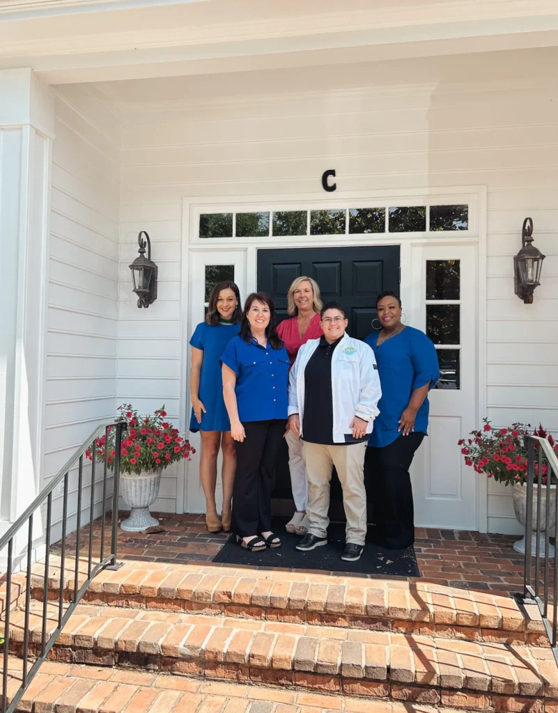 The Bay Area Professional Counseling team on the front steps of the office in Mobile, AL